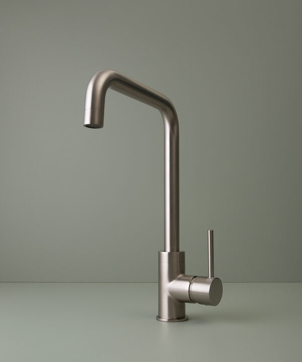 silver kintampo tap on grey-green background