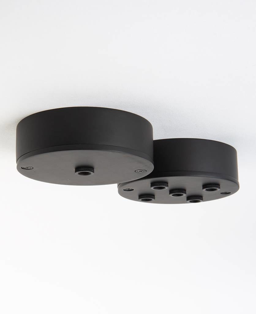 black one point ceiling rose and black five point ceiling rose against white background