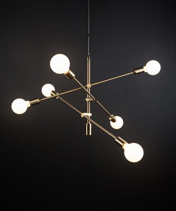 brass feature pendant lights with opal bulbs againast black background