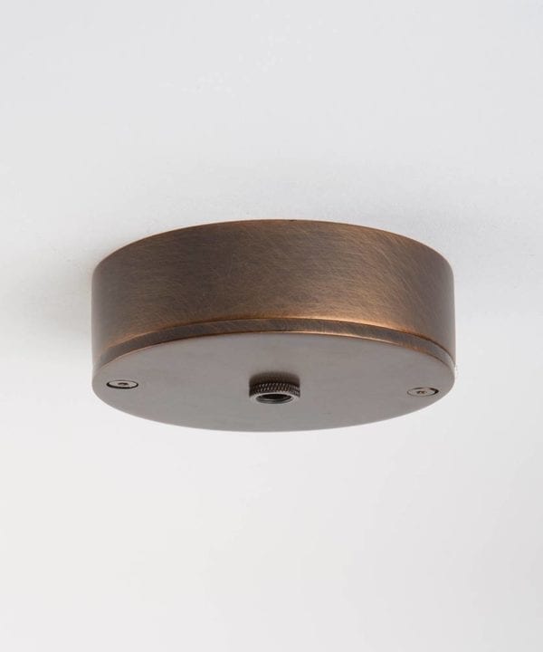 one point brewer's brass ceiling rose against white background