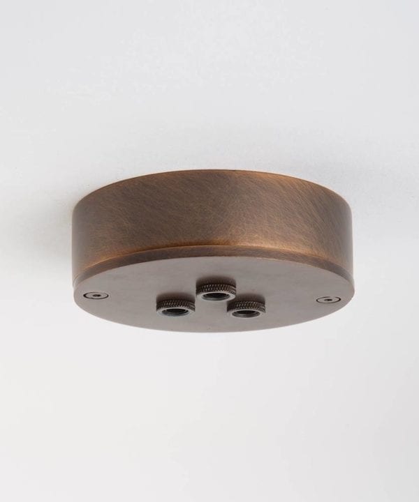 three point brewer's brass ceiling rose against white background