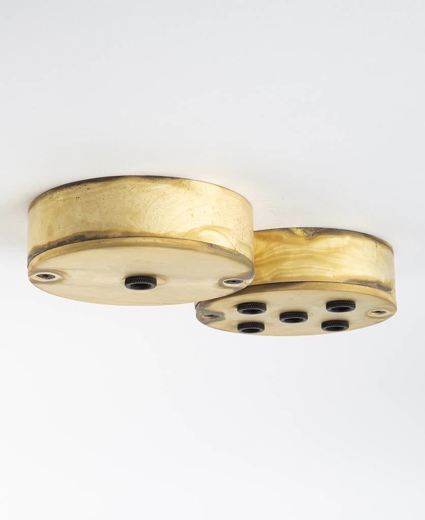 smoked gold one point ceiling rose and smoked gold five point ceiling rose against white background