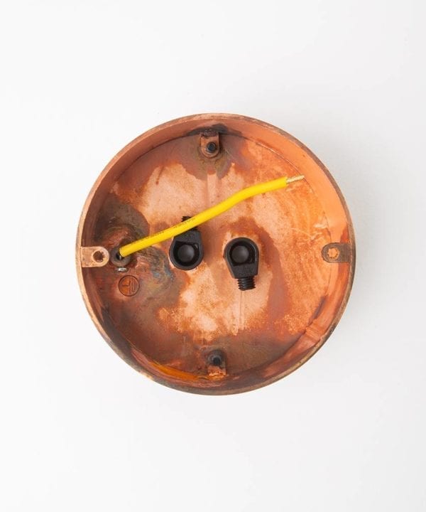tarnished copper two point ceiling rose reverse view against white background