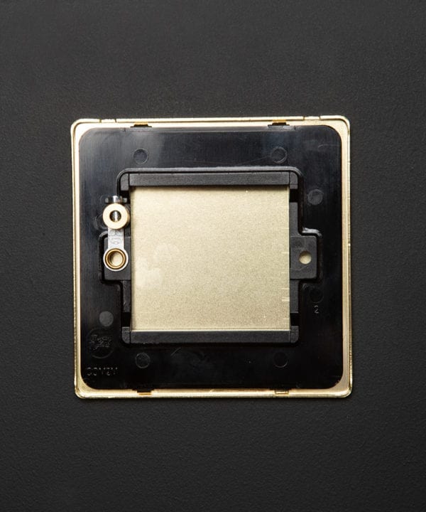 back view of single gold blank fascia on black background