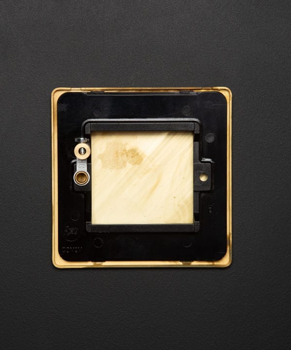 back view of single smoked gold blank fascia on black background