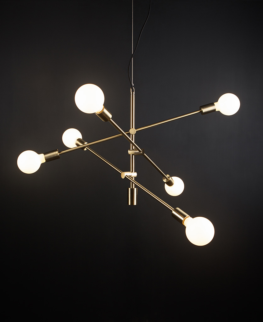 gold trikonasana ceiling pendant with adjustable arms and five opal light bulbs against black background