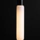 luna lit tube light bulbs with black bakelite bulb holder against black wall