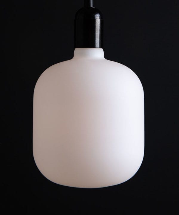 pandora unlit square light bulbs suspended from black bakelite bulbholder against black background