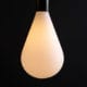 Lit Celestia decorative bulbs susoended from black bakelite bulbholder on black background