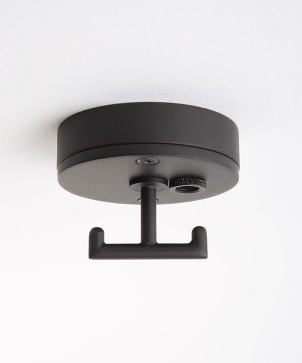 black ceiling rose with t shaped hook against white background