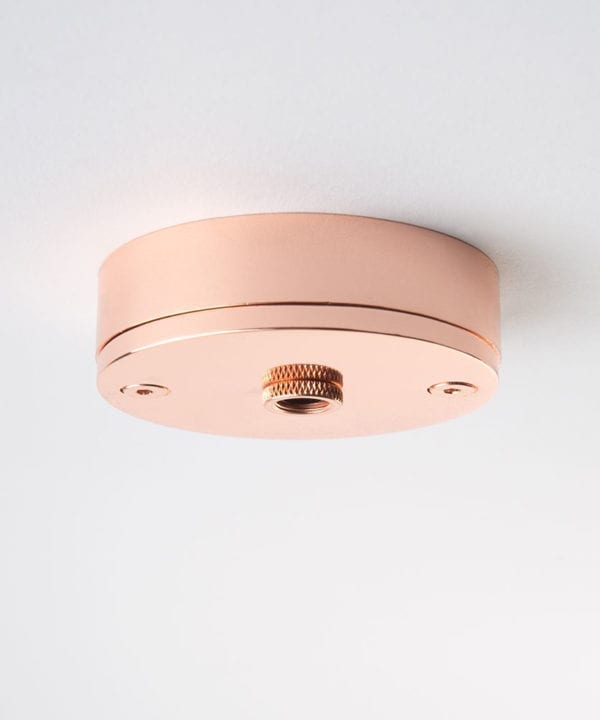 small copper ceiling rose against white background