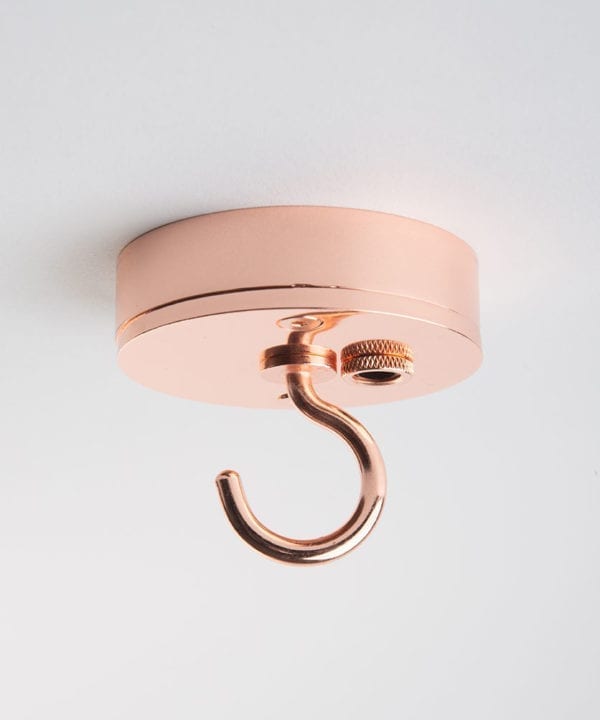 Small copper ceiling rose with c shaped hook against white background