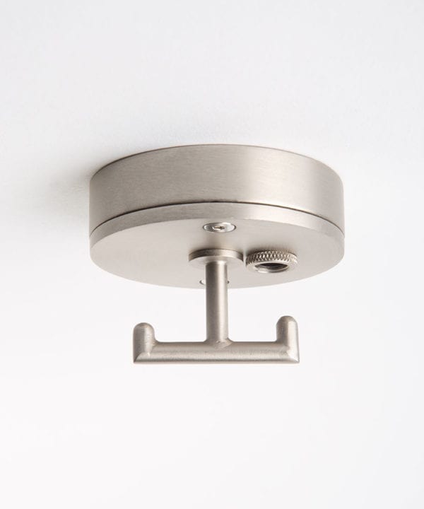 silver ceiling rose with t shaped hook against white background