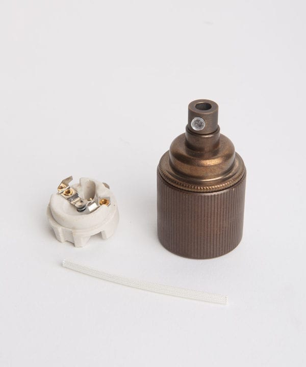 brewer's brass e27 ribbed ES lamp holder with porcelain insert against white background