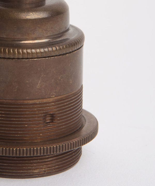 closeup of brewer's brass threaded e27 lamp holders against white background