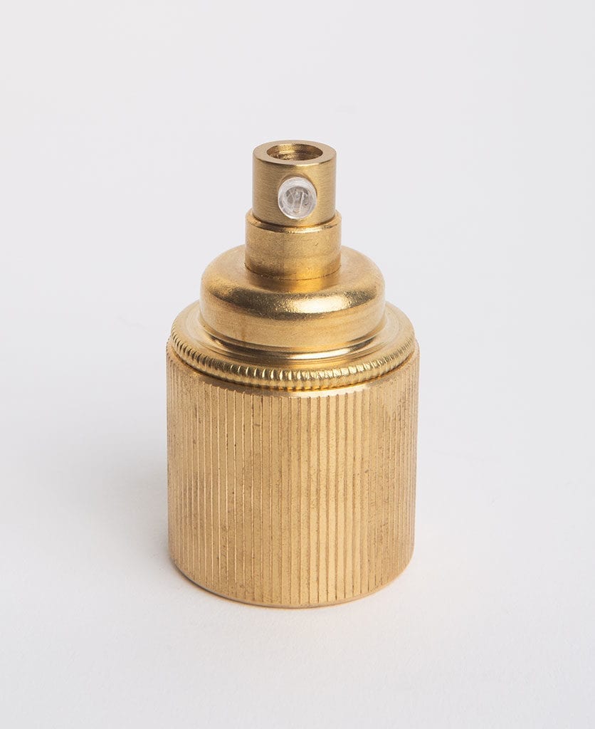 raw brass e27 ribbed bulb holder against grey background