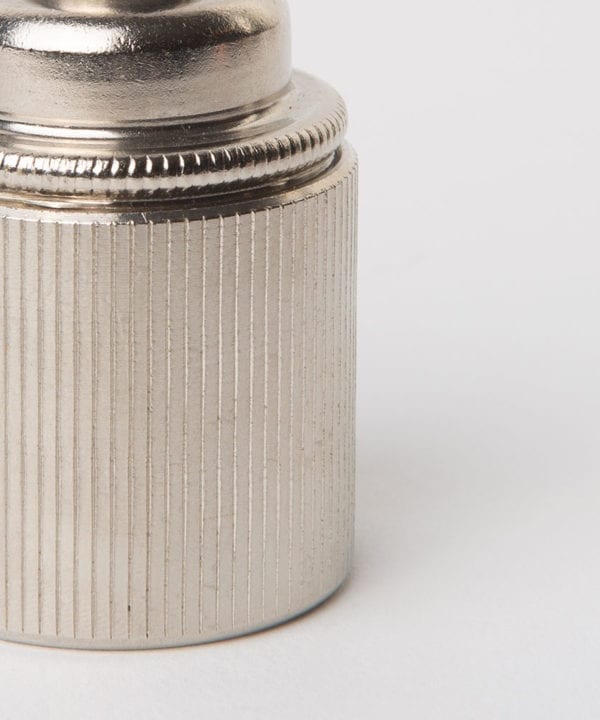 closeup of forgotten silver e27 ribbed lamp holder against white background