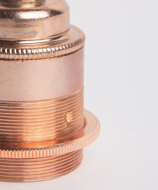 closeup of polished copper threaded e27 bulb holders against white background