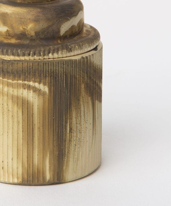 closeup of smoked gold e27 holder with ribbed detail against white background