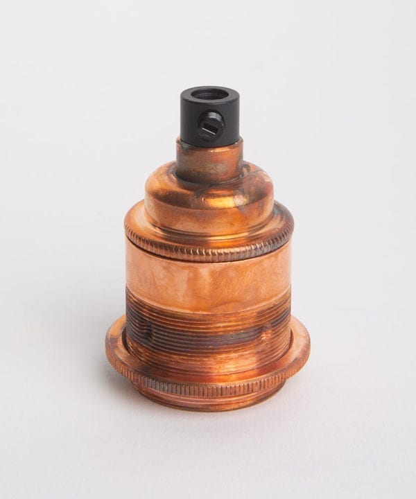 tarnished copper threaded e27 bulb holders against white background