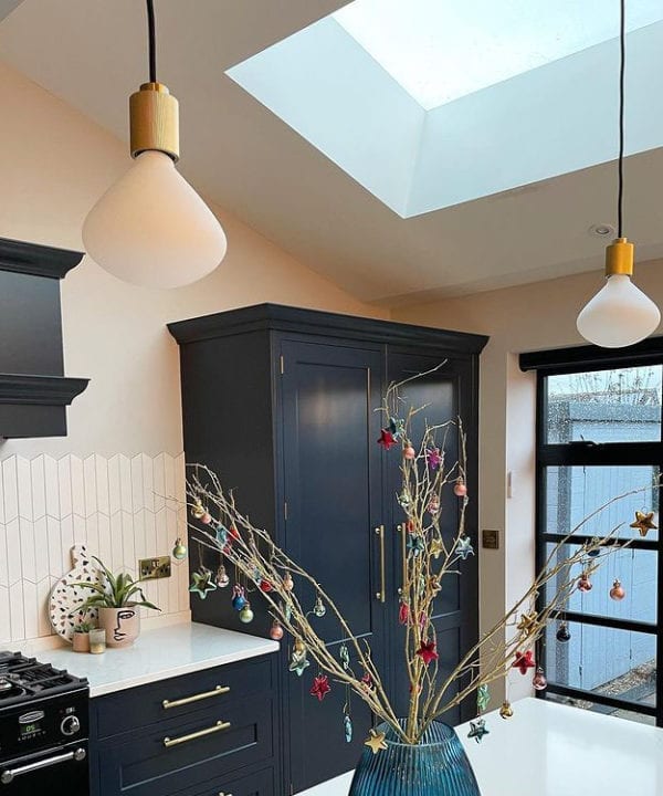 lanesborough pendant light with Nova bulbs suspended above a kitchen island