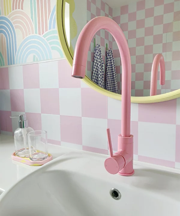 Pink Tinkisso tap over bathroom sink.