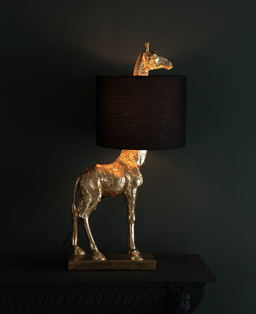 sky giraffe table lamp against black background