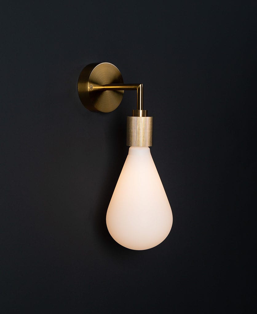 Grosvenor gold wall light against black background