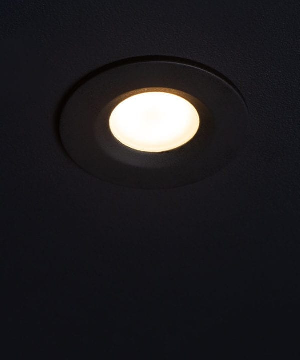 GU10 bulbs downlighter against black ceiling