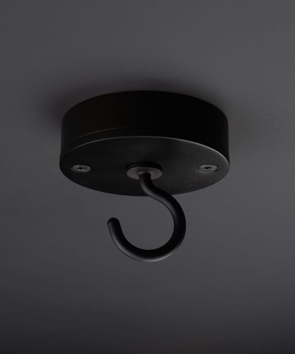 black ceiling hook against black background