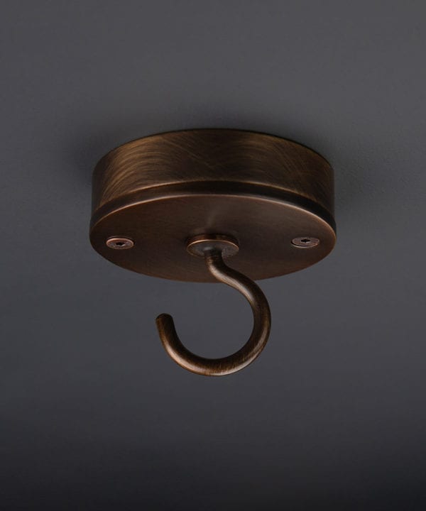 brewer's brass ceiling hook on black background