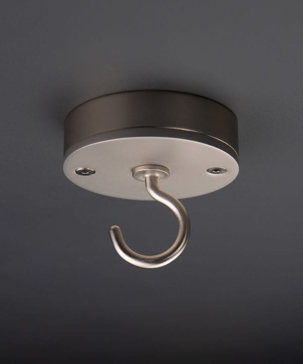 silver ceiling hook against black background