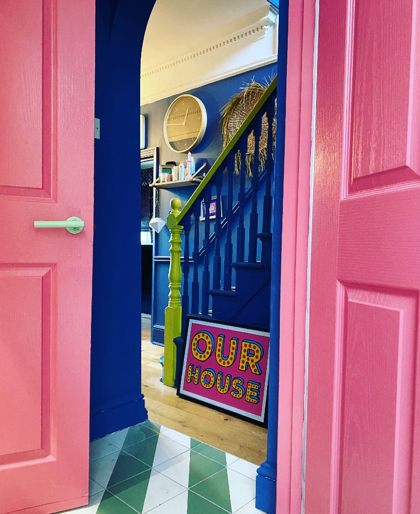 neo mint door handle on a pink internal door