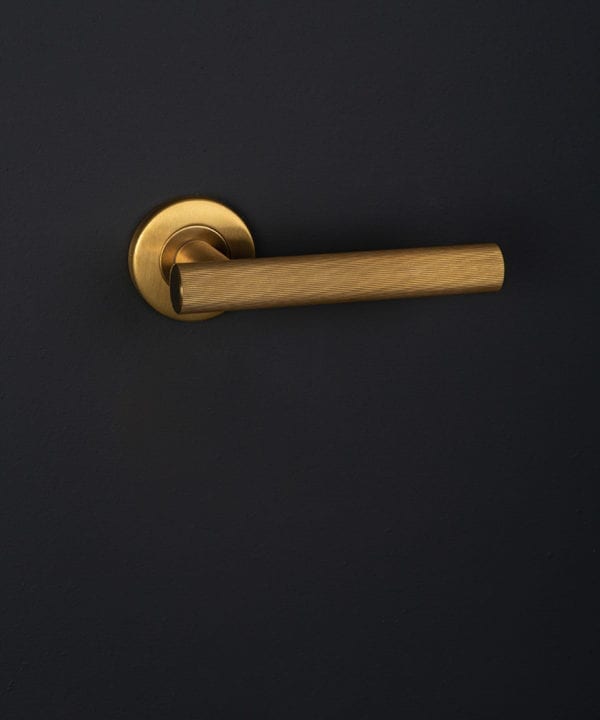 kramer gold on black wall