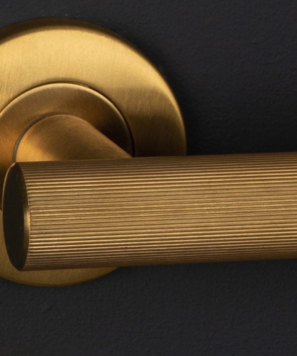 kramer closeup gold on black wall