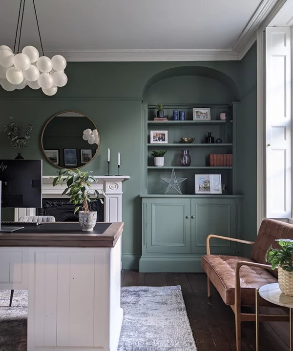 Medium frosted bubble chandelier in a forest green office space.