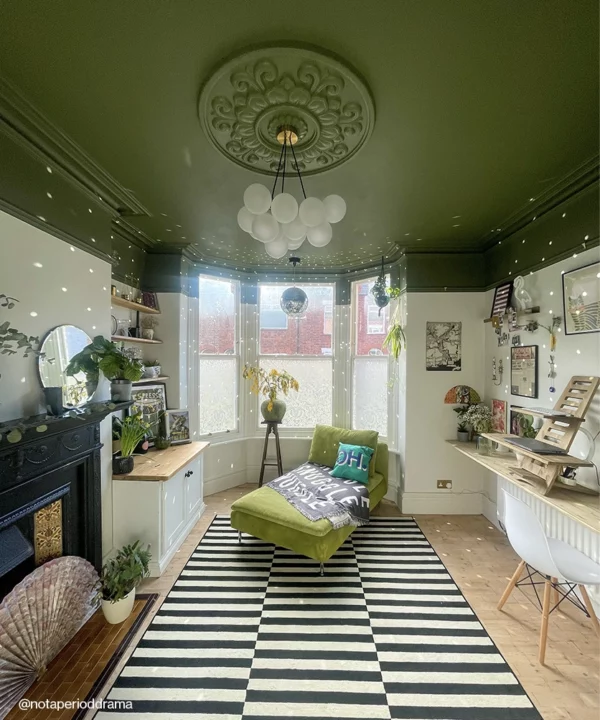 Medium bubble chandelier on a green ceiling.