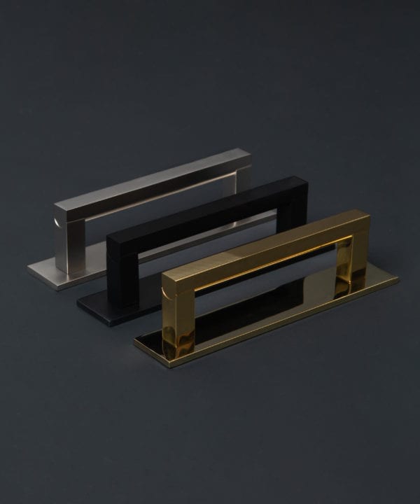 taipei metal handles with plate in black, silver & brass against black background