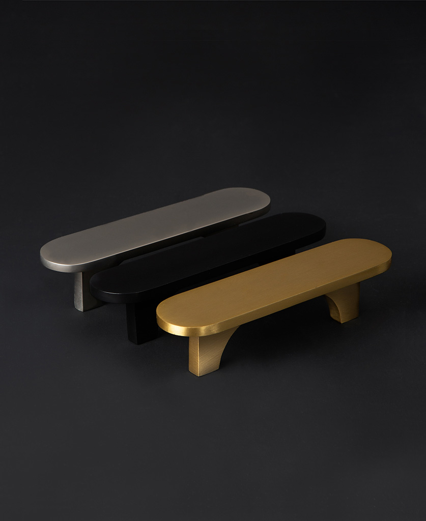 gold, silver and and black chrysler lozenge shaped kitchen drawer handles