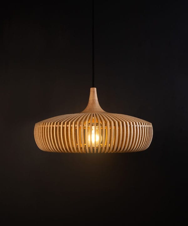 wooden slatted pendant lampshade with black cord against black background