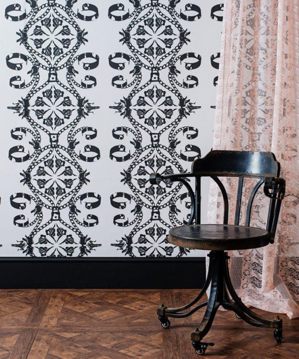 Maitrise White Wallpaper With Black Illustrations Set With Wooden Floors and Chair