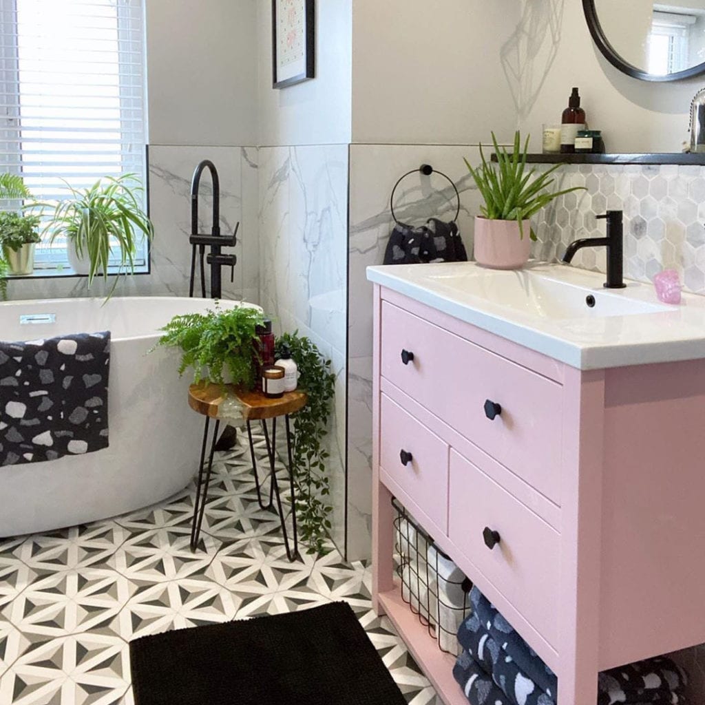 bauhaus hexagonal drawer knobs on pink drawers in monochrome bathroom