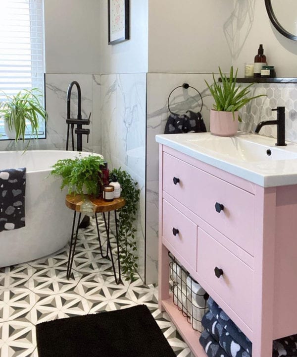 bauhaus hexagonal drawer knobs on pink drawers in monochrome bathroom