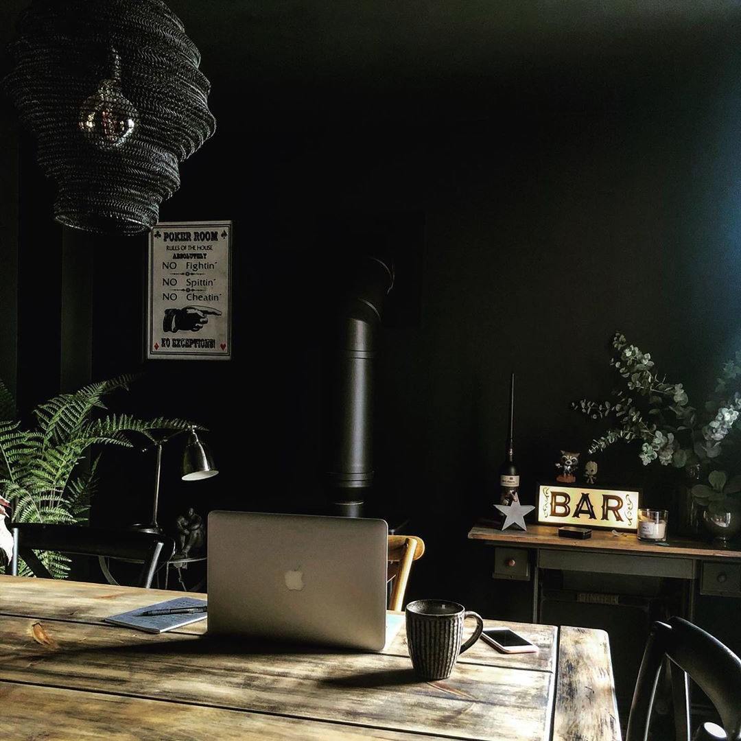 baya nest light in black above an office desk to spruce up the interior