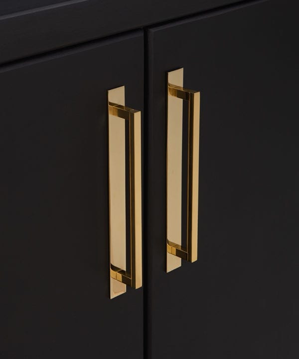 gold metal 24.2cms kitchen door handles on black cupboard