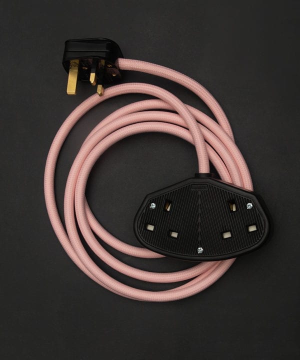 miami pink fabric extension cable with double black socket and plug against black background