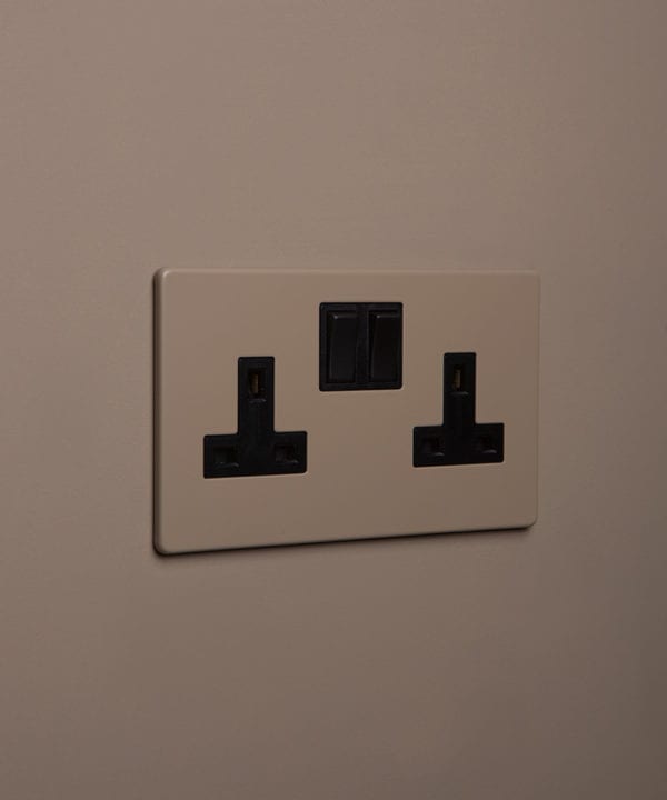 caramel latte double plug socket with black insert on caramel latte background