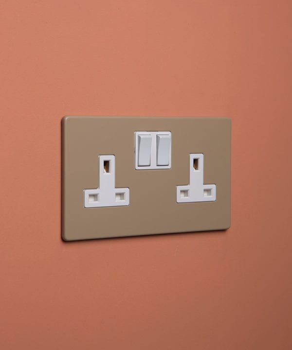 caramel latte double plug socket with white insert on cinnamon background