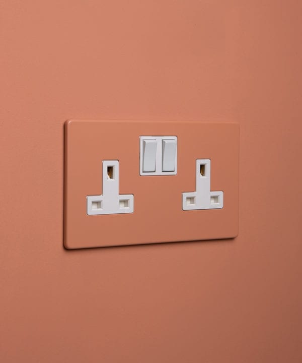 cinnamon double plug socket with white insert on cinnamon background