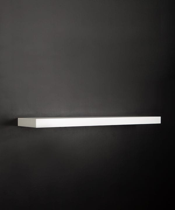 large white floating shelf on black background